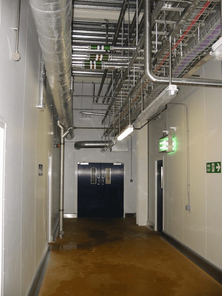 Dairy factory wall penetration and utility design